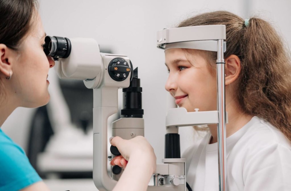 Optometrist performing an eye exam on a child client.